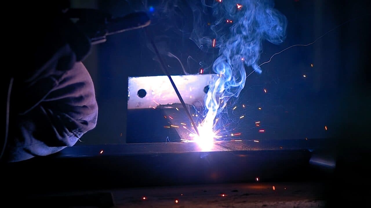 A welder fabricating a custom metal project